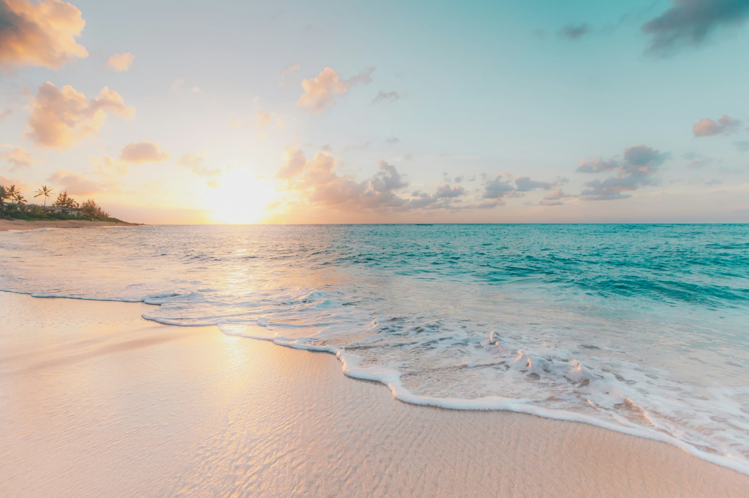 Pale sand beach with translucent water